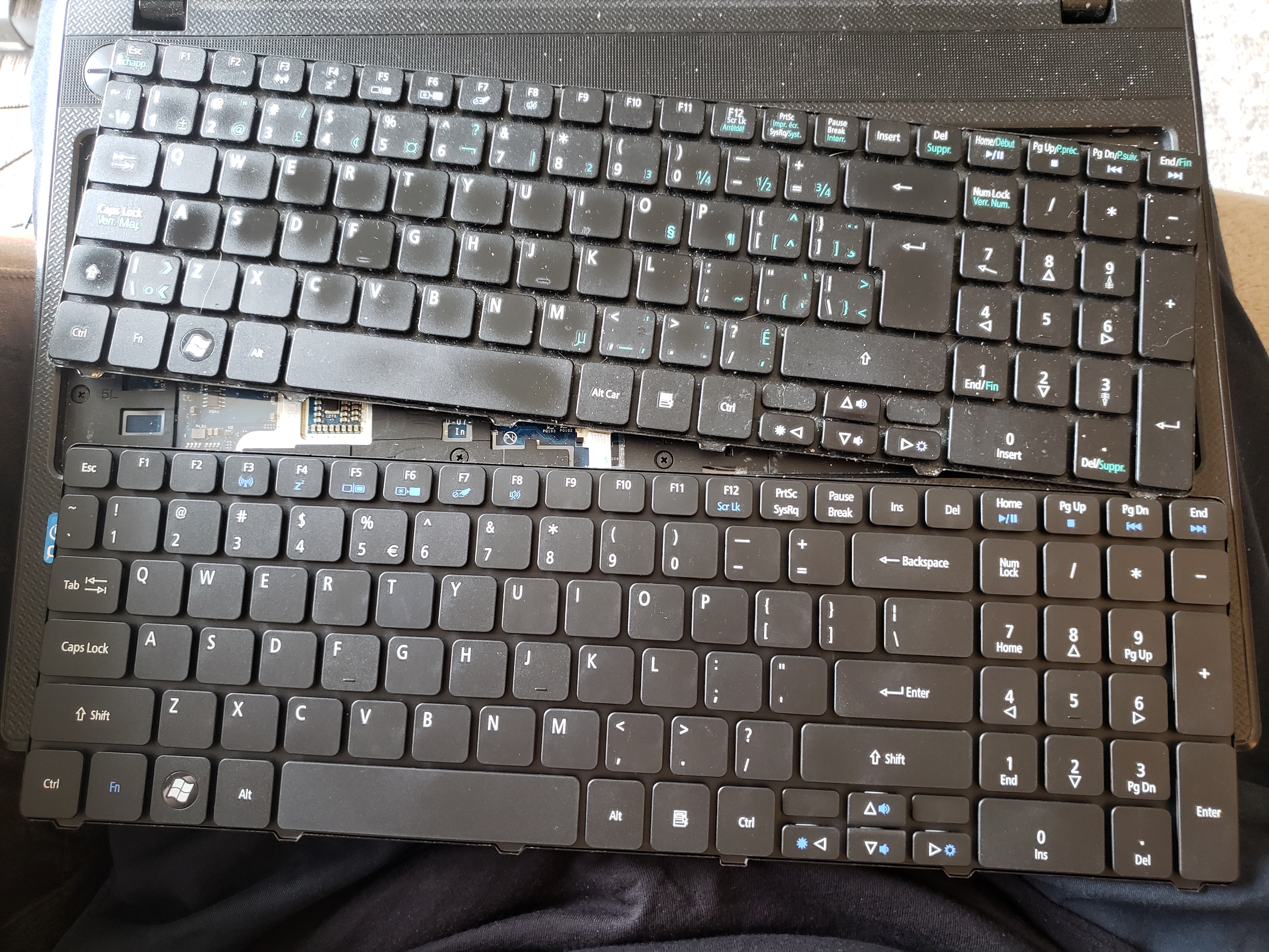 new keyboard beside old broken keyboard