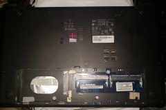 laptop with hard drive and ram pulled for upgrades